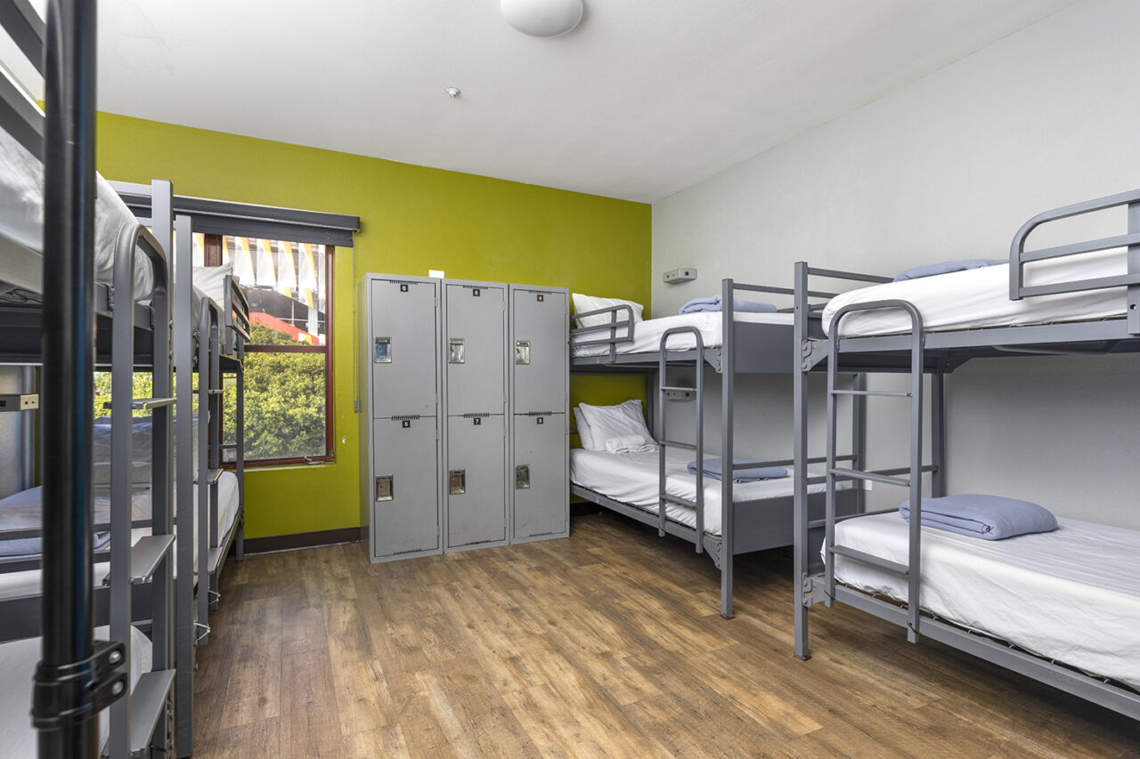 A clean and bright 8-bed dorm room at HI Los Angeles Santa Monica hostel