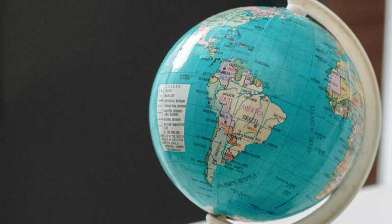 a small globe is turned to show the continent of South America